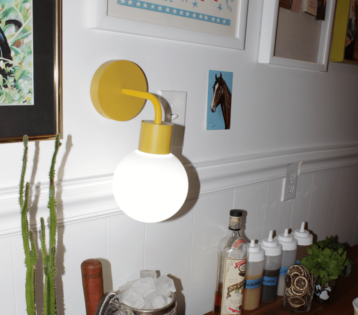 Marigold wall light sconce in a small bar corner