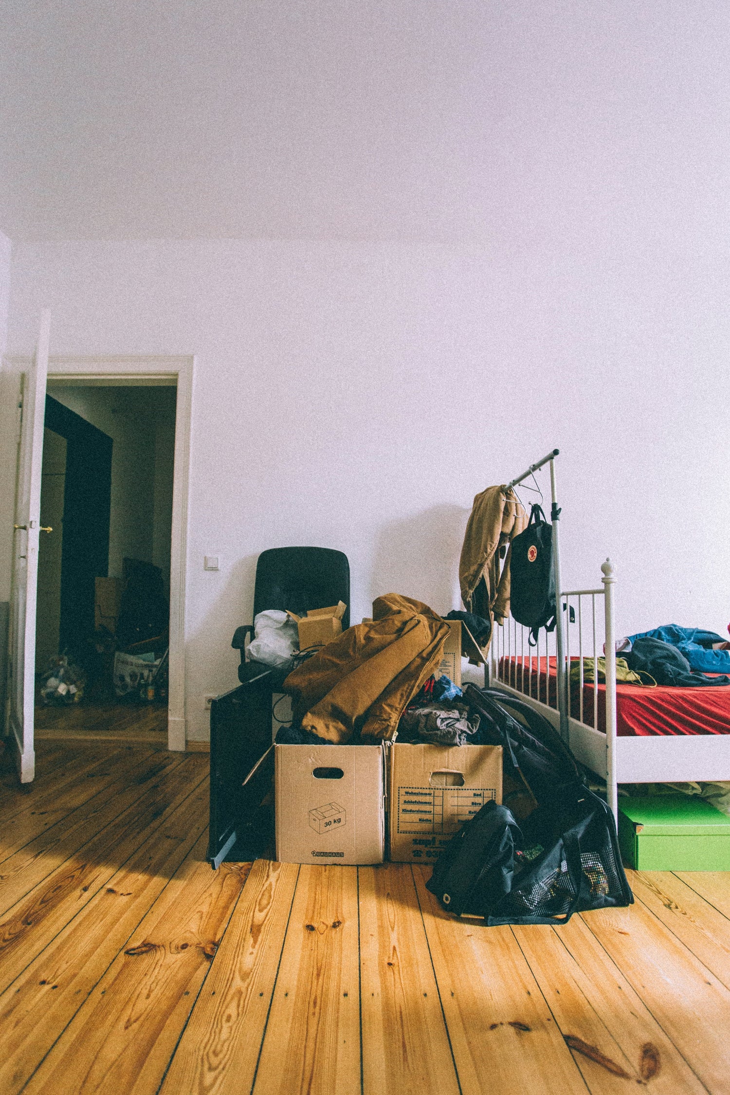 Apartment room with cluttered things and boxes