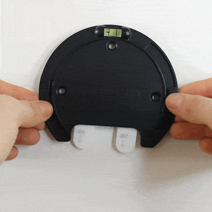 Using the level to attached the base to the wall of the rechargeable wall light sconce