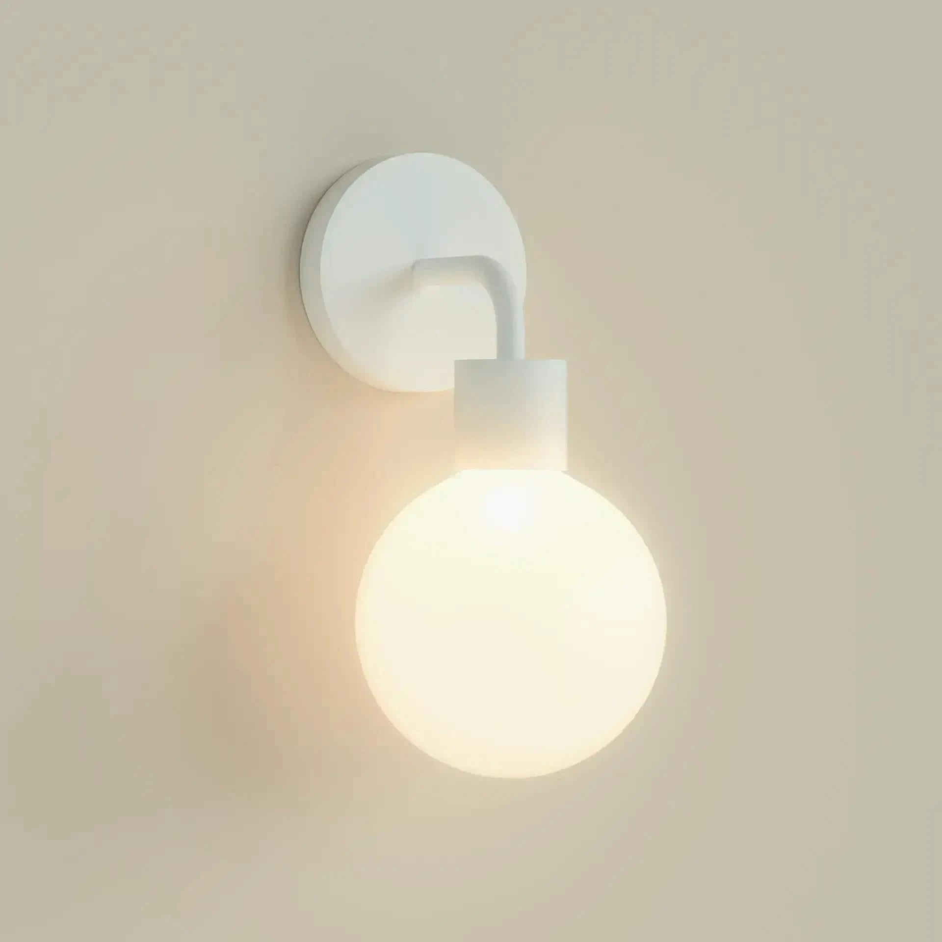White Poplight wall light, rechargeable and dimmable with customizable color temperatures, ideal for quick installation and USB-C charging.