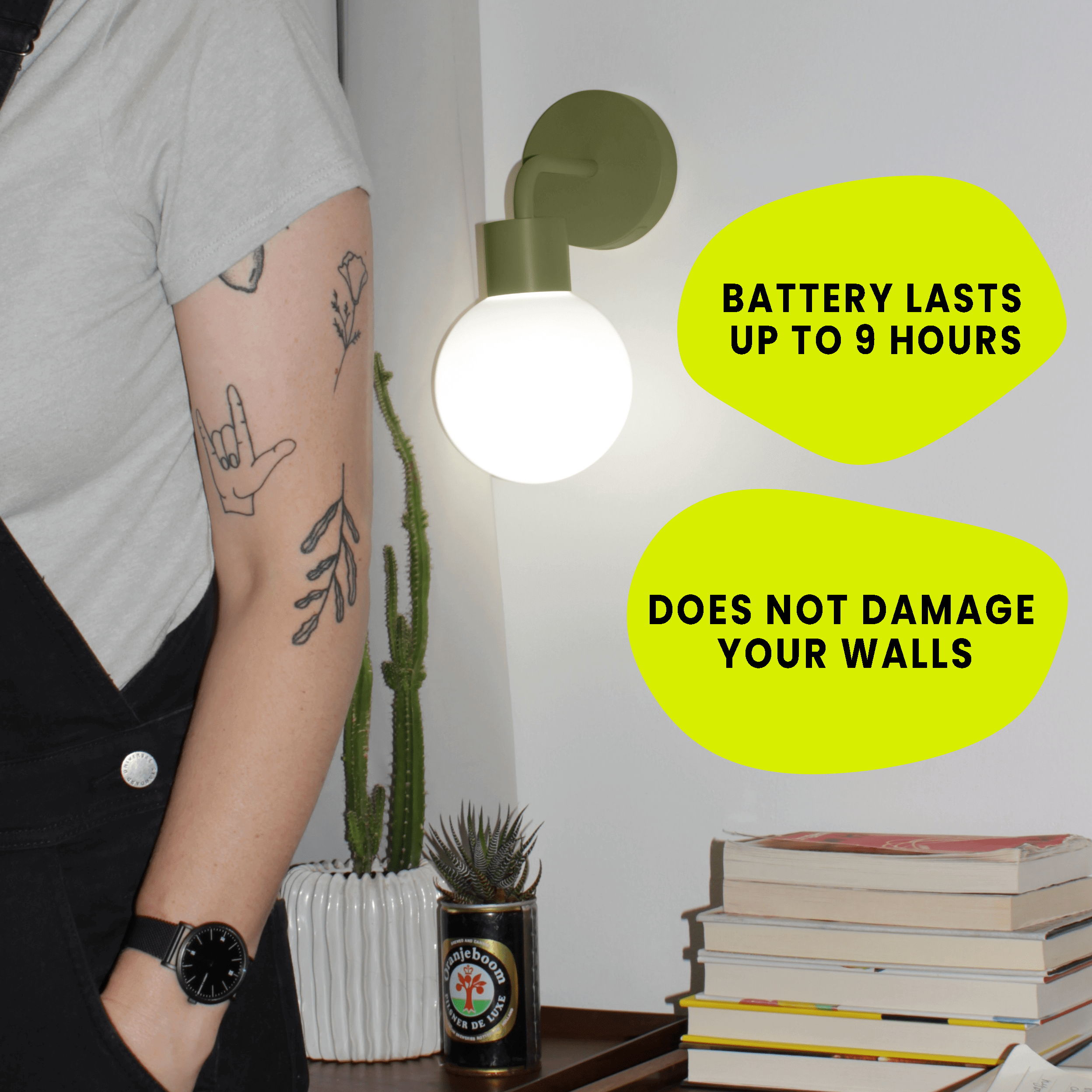 Sage Green rechargeable wall sconce in warm light temperature and a tattooed arm