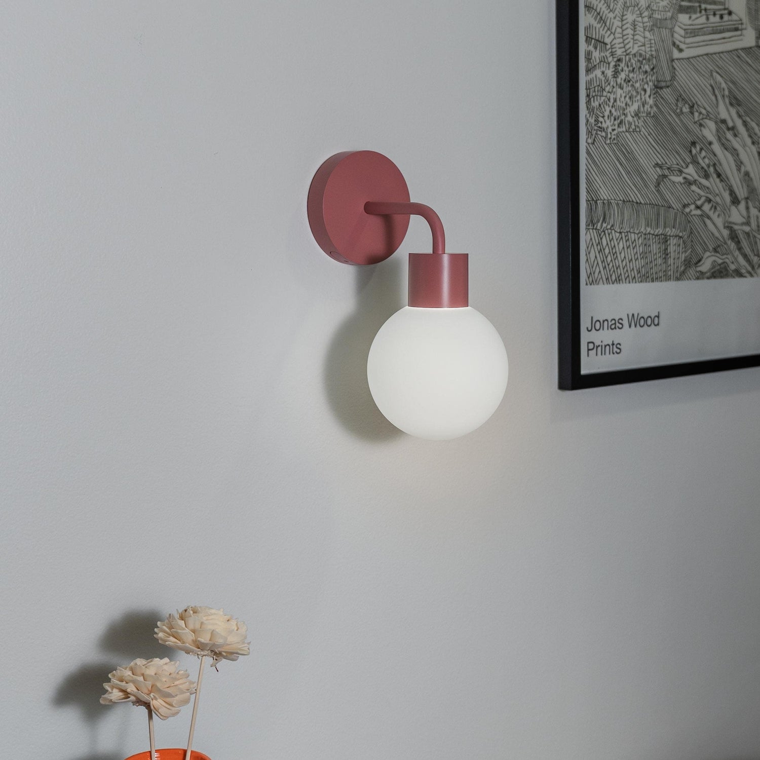 Modern rechargeable wall sconce with globe design illuminating a stylish interior space, enhancing decor and ambiance.