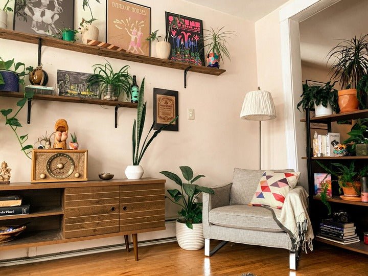 Small apartment living room with accent chair and pillow.