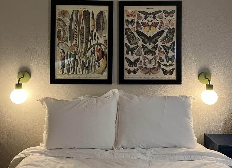Sage green rechargeable wall sconces gives a warm and cozy vibe in the bedroom