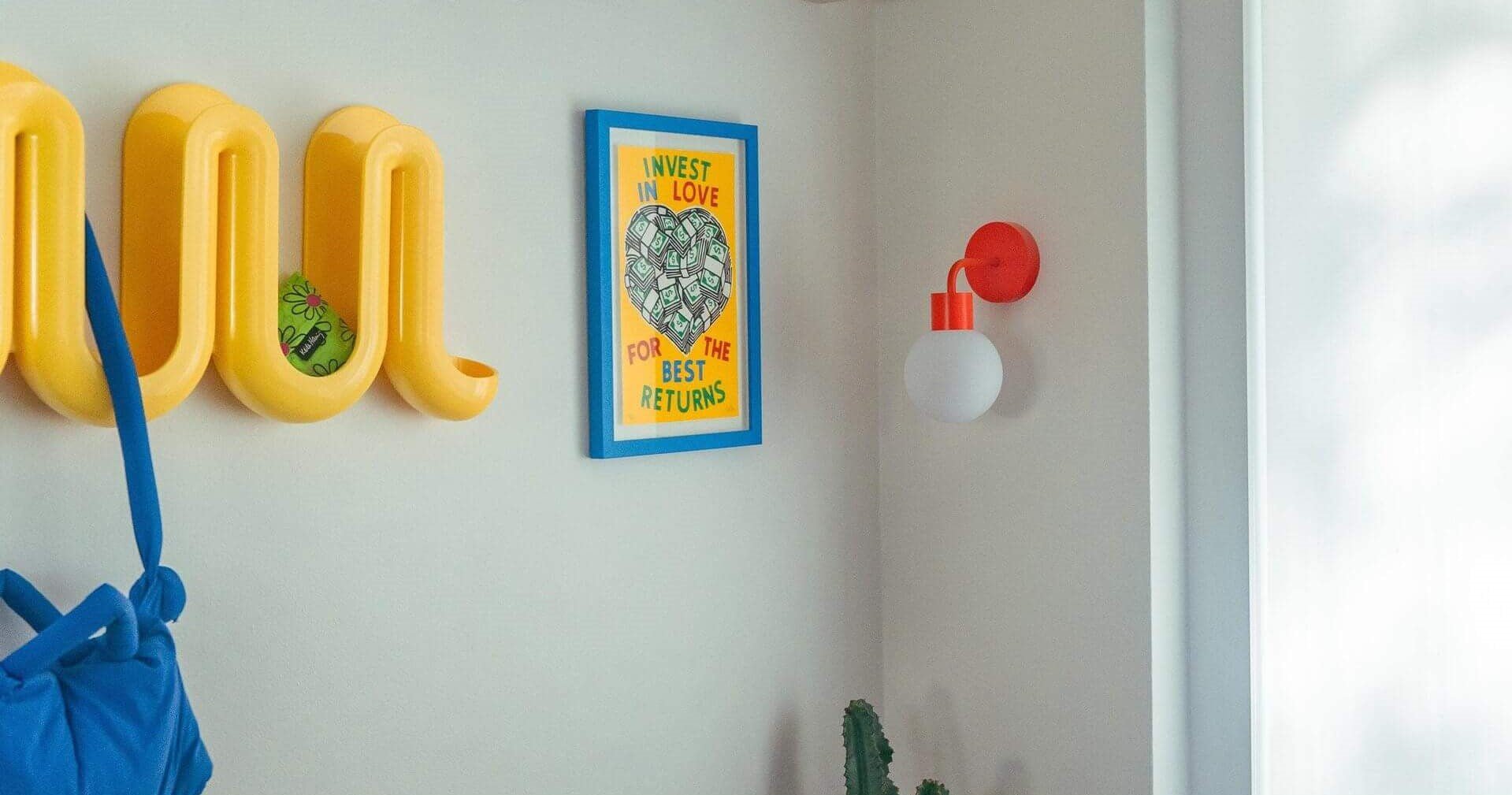 Renter-friendly wall decor including Poplight rechargeable wall light sconce.  