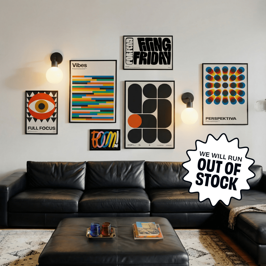 Black leather sofa and ottoman below gallery wall with Black Poplight rechargeable wall sconces and a text graphic overlay that reads "We will run OUT OF STOCK."