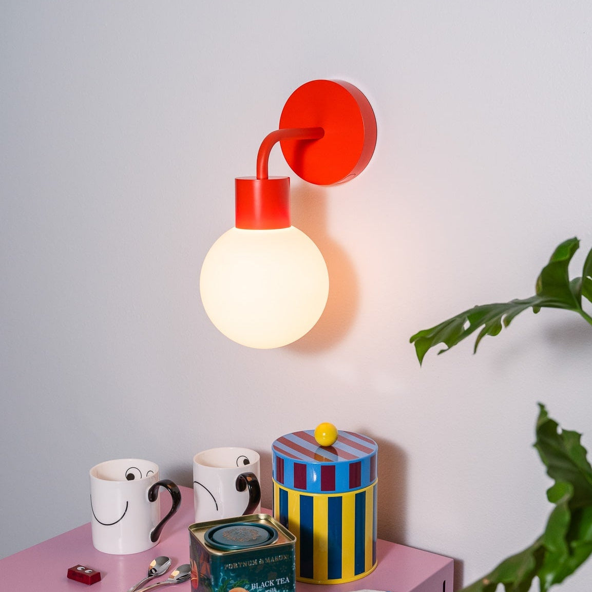 vermillion red rechargeable wall sconce colorful home upgrade with plants