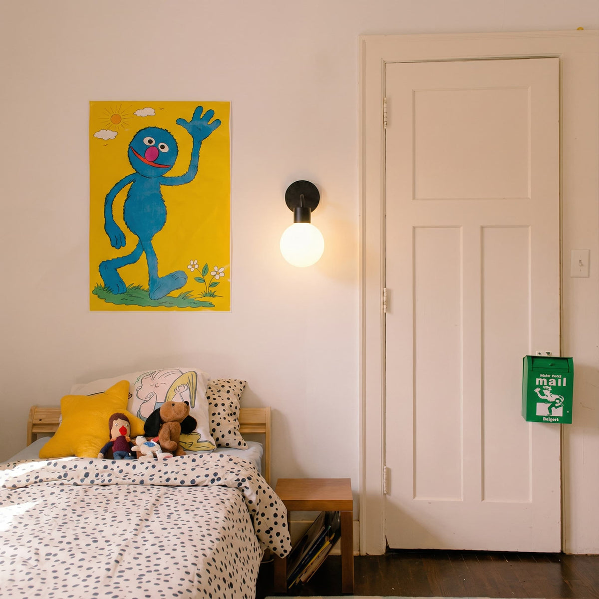 Kids room with a single wall art and a black rechargeable wall light sconce
