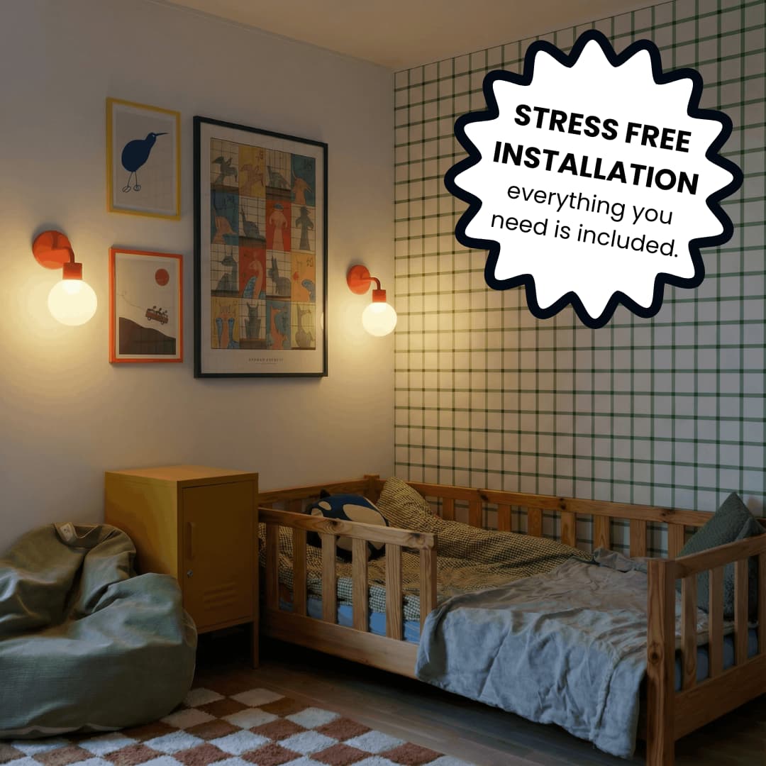 Kids room with some wall arts, 2 vermillion red rechargeable wall light sconces  and a text blurb strees free installation