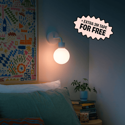 A cozy bedroom corner with White Poplight rechargeable wall sconce featuring a promotional badge for &quot;EXTRA 3M TAPE.&quot;