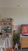 A woman in a video updating her space for a modern and relaxing ambient using PL rechargeable wall sconce